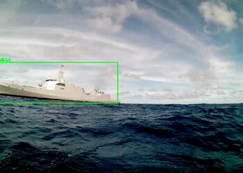 US Drone Faces Off Against Chinese Carrier: Photos Reveal Tension