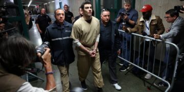 Luigi Mangione, accused of fatally shooting UnitedHealthcare CEO Brian Thompson on December 4, 2024, had two charges dismissed in state court. Mangione, 27, faced nearly a dozen charges for the shooting outside a midtown Manhattan hotel.